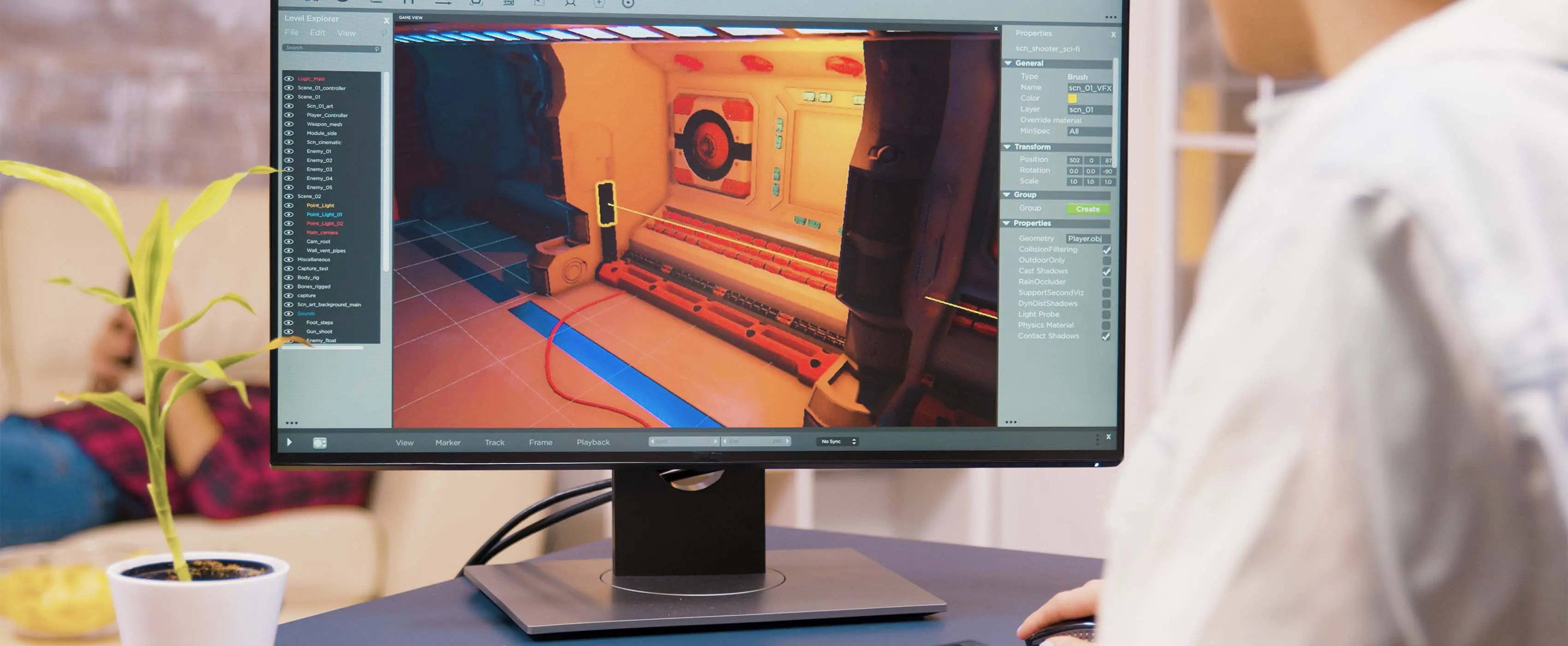 Foto de tela de computador com uma pessoa editando em um software de animação.