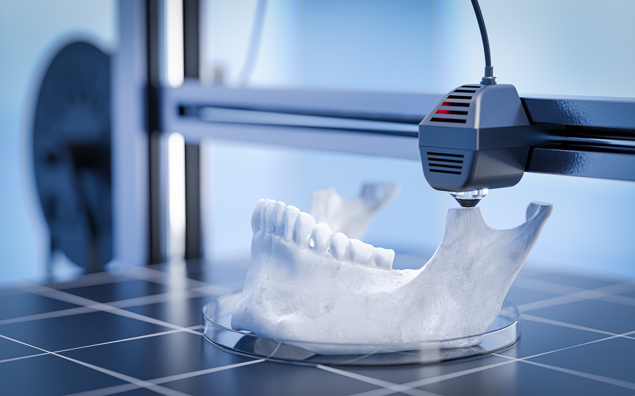 Arcada dentária sendo impressa em impressora 3D.