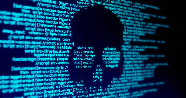 Imagem de tela de computador com fundo preto e códigos de programação com letras azuis desenham um crânio de caveira Imagem de tela de computador com fundo preto e códigos de programação com letras azuis desenham um crânio de caveira